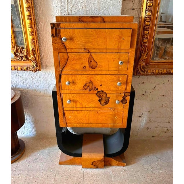 Elevate your interior with this stunning Art Deco Burl Wood Chest of Drawers, a masterpiece of geometric elegance and...