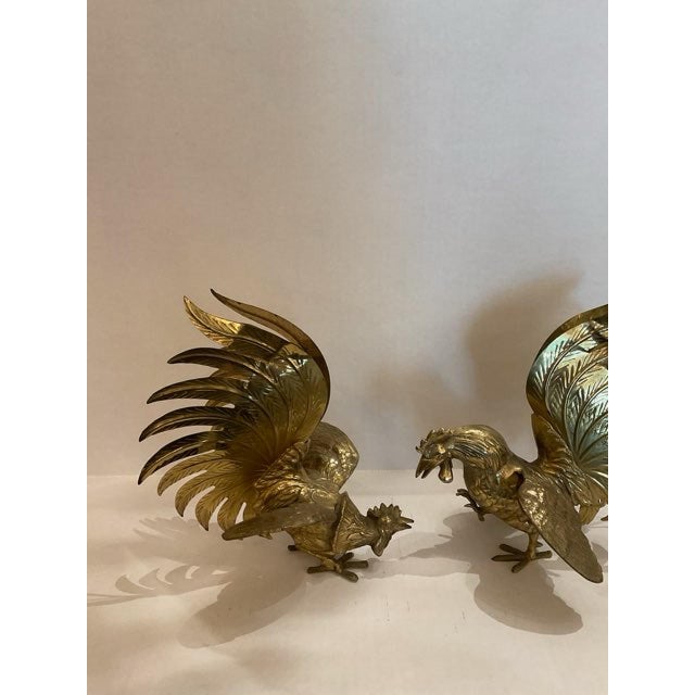 This listing features a pair of brass fighting roosters. These brass rooster figurines add a touch of country charm to any...