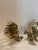 This listing features a pair of brass fighting roosters. These brass rooster figurines add a touch of country charm to any...