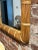 A soft arch and natural rattan frame give this vintage mirror its easy, coastal charm. Hand-wrapped reed bindings trace...