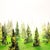 This artwork presents a whimsical interpretation of a misty forest, featuring stylized trees constructed from acrylic...