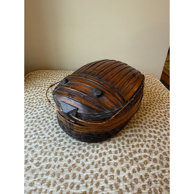 A Lovely and Whimsical Vintage Mid-20th Century Beetle Bug Bamboo Chinese Tiffin Basket. This piece was made in China and...