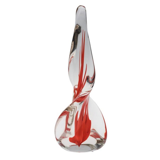 Spiraling clear-glass obelisk with red flame-like intrusions made by Venini. One of Venini's most celebrated models. This...
