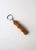 An English Sheffield stainless steel bottle opener with a natural bamboo handle, in the Campaign design style, circa mid‑...