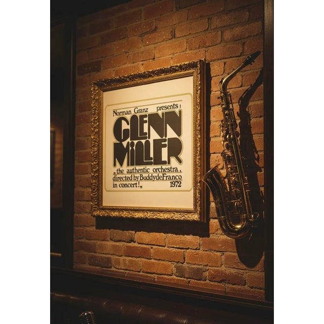 This original 1972 concert poster captures the timeless spirit of the Glenn Miller legacy, presented by legendary jazz...