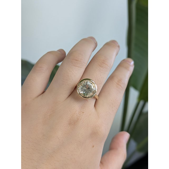 A luminous 12mm prasiolite glows against rich 14k yellow gold for effortless sophistication. A statement solitaire that’s...