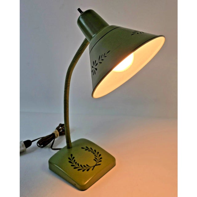 Bring timeless style and functional elegance to your space with this Mid-Century Laurel Leaf Desk Lamp by Keystone Lamp...