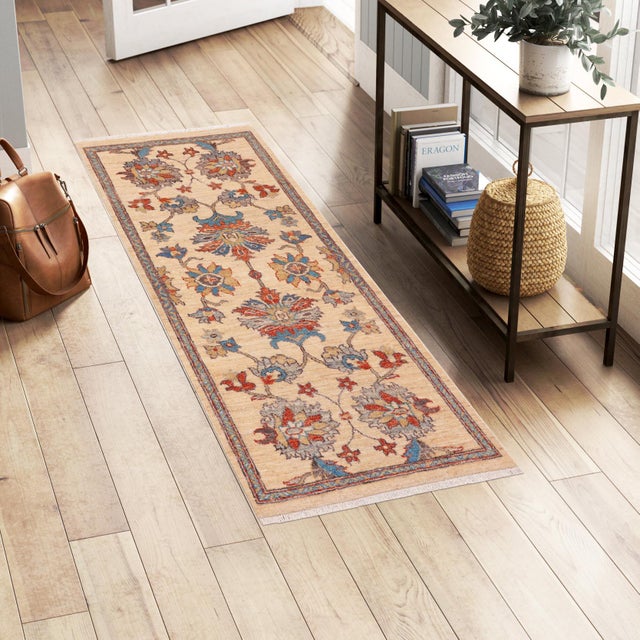 Enhance the ambiance of your home with this magnificent Persian-influenced Turkish hand-knotted rug made by skilled...