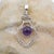 Vintage artesian crafted pendant with a modern sterling silver structure with natural amethyst gemstone at its center....