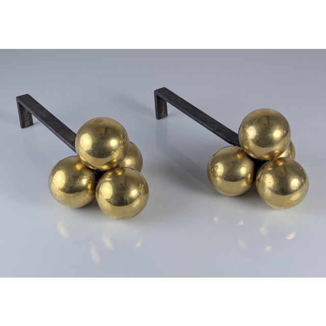 This pair of andirons, designed by Jacques Adnet in France in the 1930s, exemplifies the transition from traditional Art...