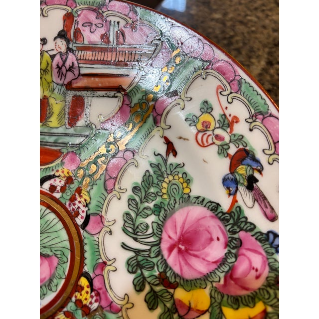 Beautiful Chinese export rose medallion porcelain plate with hand painted butterflies birds, human figures and floral...