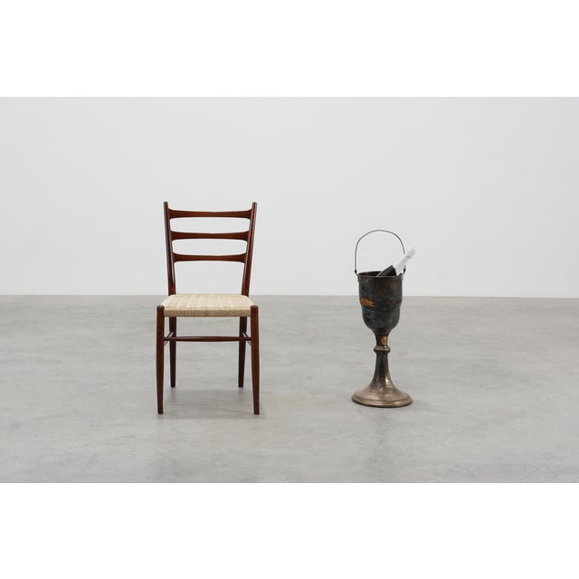 A rare and atmospheric Art Deco champagne bucket on stand, crafted in France around 1910 from silvered copper. This...