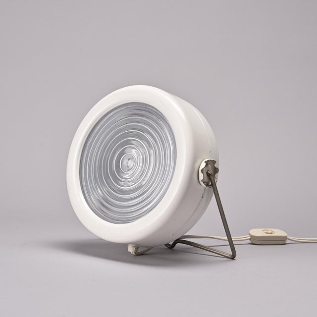 Sciuko lamp designed by Achille Castiglioni in Italy in the 1970s. The circular white-lacquered metal body houses a...