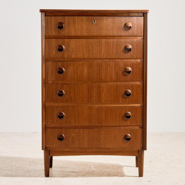 Danish teak dresser with six drawers from the 1960s. The surface of the dresser has scratches, stains and wear in places,...