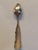 Antique Dutch silver teaspoon featuring a plain oval bowl and a distinctive scalloped handle. The maker's punch appears...