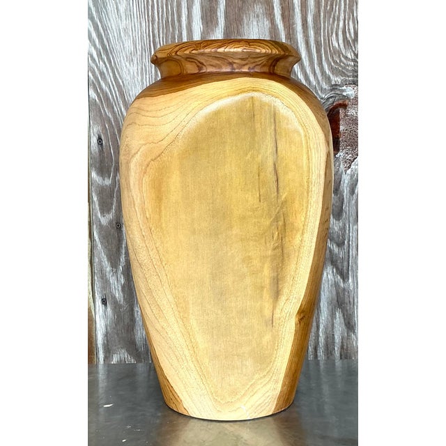 Add a striking accent to your space with this Vintage Boho Turned Wood Tall Vase. Standing tall with graceful curves, this...