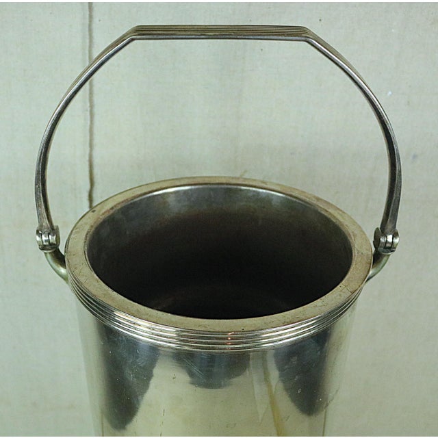 A freestanding Champagne cooling bucket made in France in the middle of the 20th century. It is made of steel with a...
