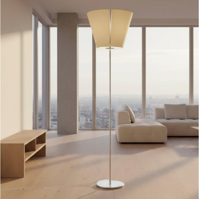 Designed by Adrien Gardère for Artemide in the 2000s, this Mega Melampo floor lamp has an aluminum frame and satin-covered...