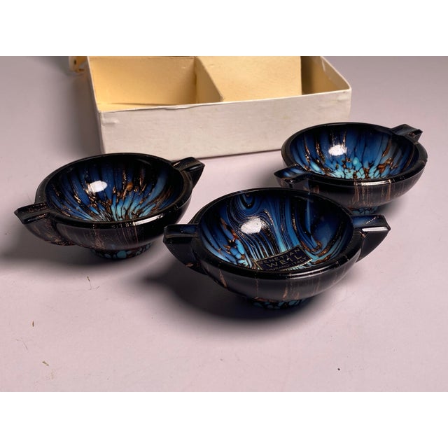 Elevate your coffee table, vanity, or executive desk with this incredibly rare, complete set of four vintage mid-century...