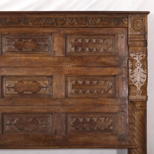 Crafted from an antique Indian teakwood door with a samll rectangular panel configuration, this king-size headboard brings...