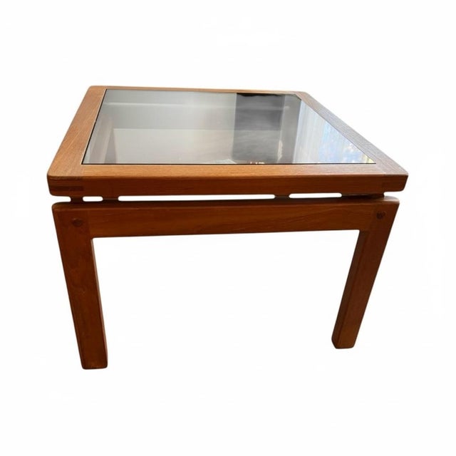 This pair of 1970s Danish Modern teak side tables exemplifies the clean-lined craftsmanship associated with Denmark’s...