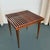 This petite walnut side table is designed by American designer Mel Smilow circa 1950s. The table perfectly captures...