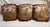 Set of three 19th-century decorative wool and silk pillows featuring charming pastoral scenes in soft, muted tones. Each...