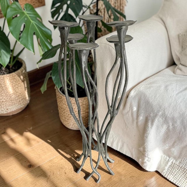Elevate your home decor with the Aluminum Candelabra Tree Roots, a stunning tall floor multi-candle holder that embodies...