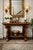 Striking and substantial Empire-style console table featuring dramatic scroll-form pedestal sides, a thick rectangular...
