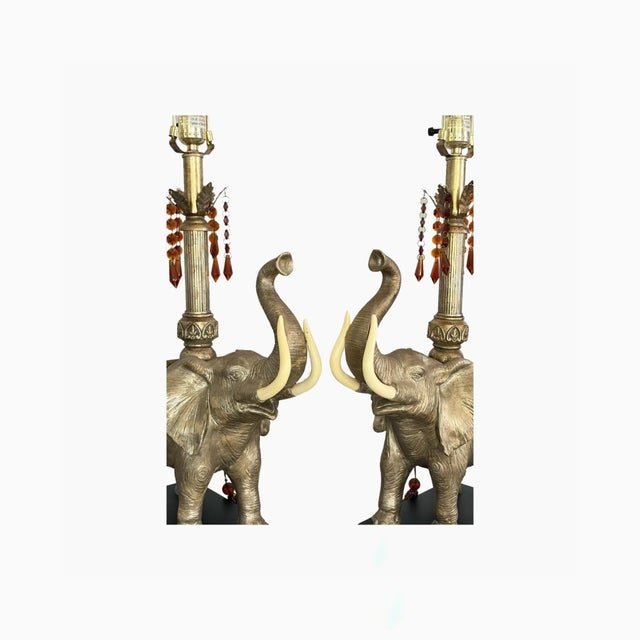 An exceptional pair of vintage designer elephant table lamps attributed to Mark Roberts, masterfully blending sculptural...