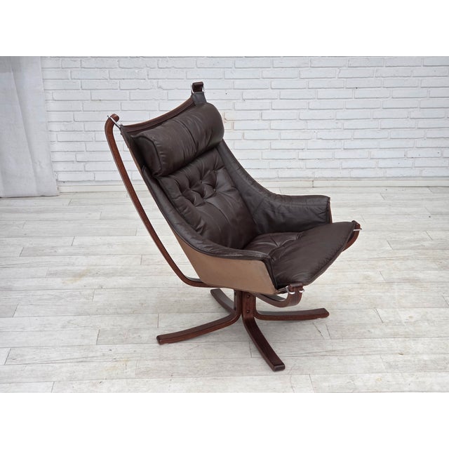 1970s, Norwegian design by Sigurd Ressel, loungechair model "Falcon", rare version with armrests. Furniture leather,...