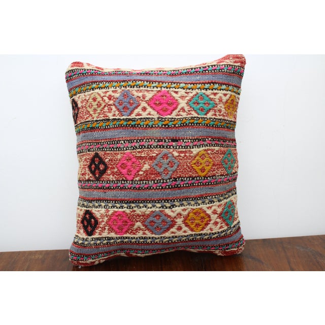 This Turkish pillow cover is made from the highest quality Vintage Kilim in 100% wool on the front. The back is covered in...
