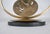 Sculpture in bronze of an oval and a disc, on a black marble oval base The bronze part is signed C Cappello 1974 and is...