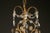 Late 19th century Italian gilded iron and crystal antique chandelier, circa 1890. Decorated with swags of randomly cut...