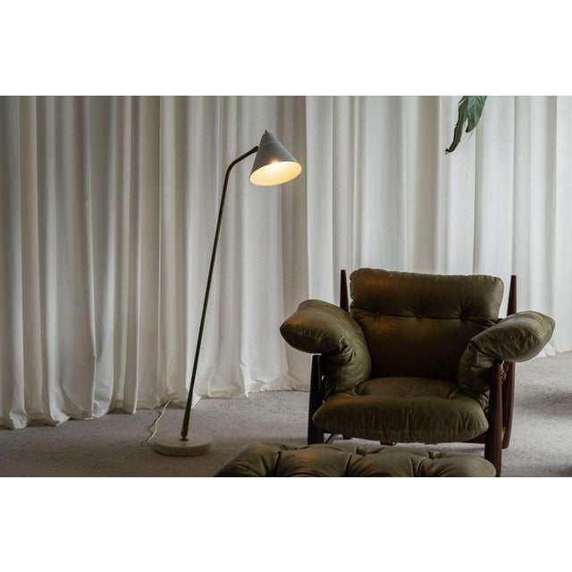 A rare and collectible example of early italian modernist lighting, this model 331 adjustable reading lamp was designed by...
