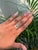 This statement ring features a 0.43 carat pear-cut natural emerald set in 14K white gold. The center stone measures...