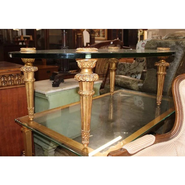 Jansen Vintage French style oval glass top coffee table. Glass is good, legs unscrew for transport. Structurally sound and...