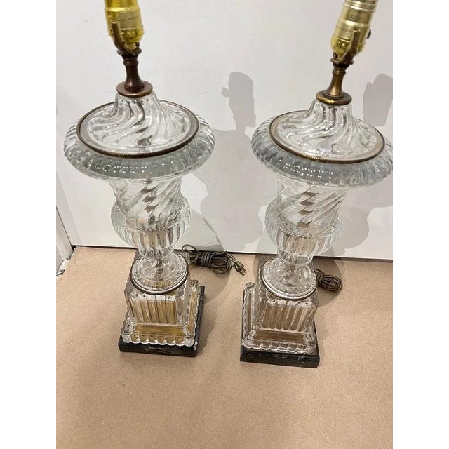 A pair of circa 1940's crystal urn shaped table lamps