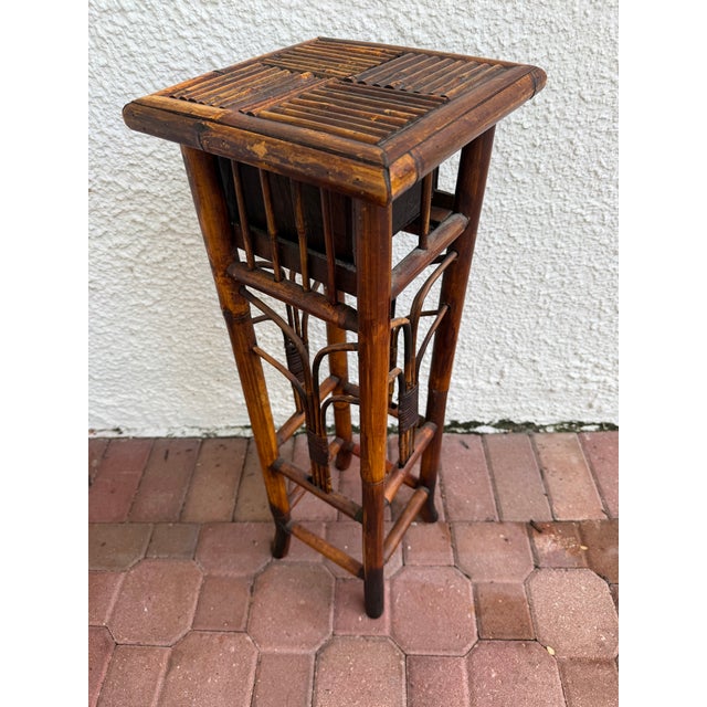 Gorgeous side table with drawer great for an entryway or plant stand. Split reed top and functional drawer