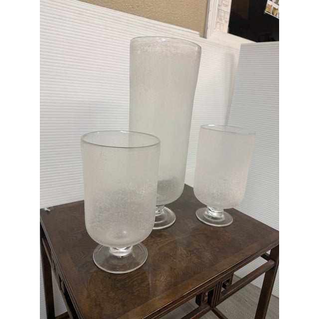Design Plus Gallery presents a Set of Three Cylindrical Frosted Glass Vases. These three decorative glass objects can also...