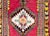 A bold and brilliant early 20th century Turkish Konya rug with a tribal pattern containing a central geometric medallion...