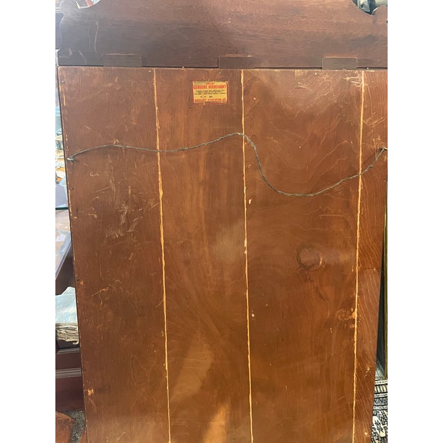 Solid mahogany mirror early 20th century by mahogany Association Inc. glass is 17 inches wide by 27 1/2 inches tall...