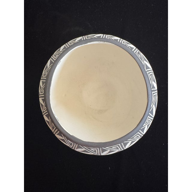 Contemporary etched sgraffito pottery jar signed on the base “Laguna, Acoma N.M. LC / GP.” Measures approximately 4.5...