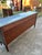 French 19th Century Louis XV Sideboard, crafted in richly figured mahogany veneer with ebonized wood framing, topped with...
