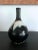 The long neck bottle of classic form was heavily potted with coarse clay with high iron content. The flask, circa 18th...