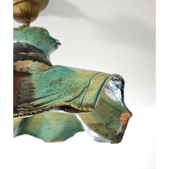 Handcrafted ceramic pendant lamp, characterized by a mid-20th-century Expressionist or Brutalist style. The lampshade...