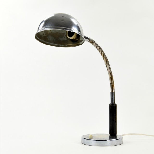 A chrome-plated desk lamp in an industrial style will be an excellent addition to a writing desk, and because it is...