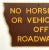Vintage one sided shaped road sign from Iowa in brown background with gold lettering and border. Sign has wear from use,...