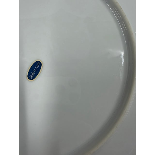 A vintage Japanese Wiwa Kinsei, Imari porcelain plate with a traditional panel design in cobalt blue and gilt. Hand-...