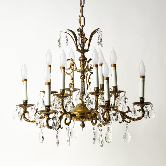 Beautiful large 26" ornate antique brass and crystal chandelier. Six arms with two candle lights each for 12 lights total....